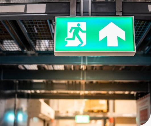 Emergency exit light installed in a commercial workplace