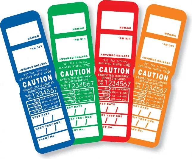 Test and tag labels in various colors (blue, green, red, orange) displaying safety compliance information for electrical equipment, emphasizing the importance of current testing for workplace safety.